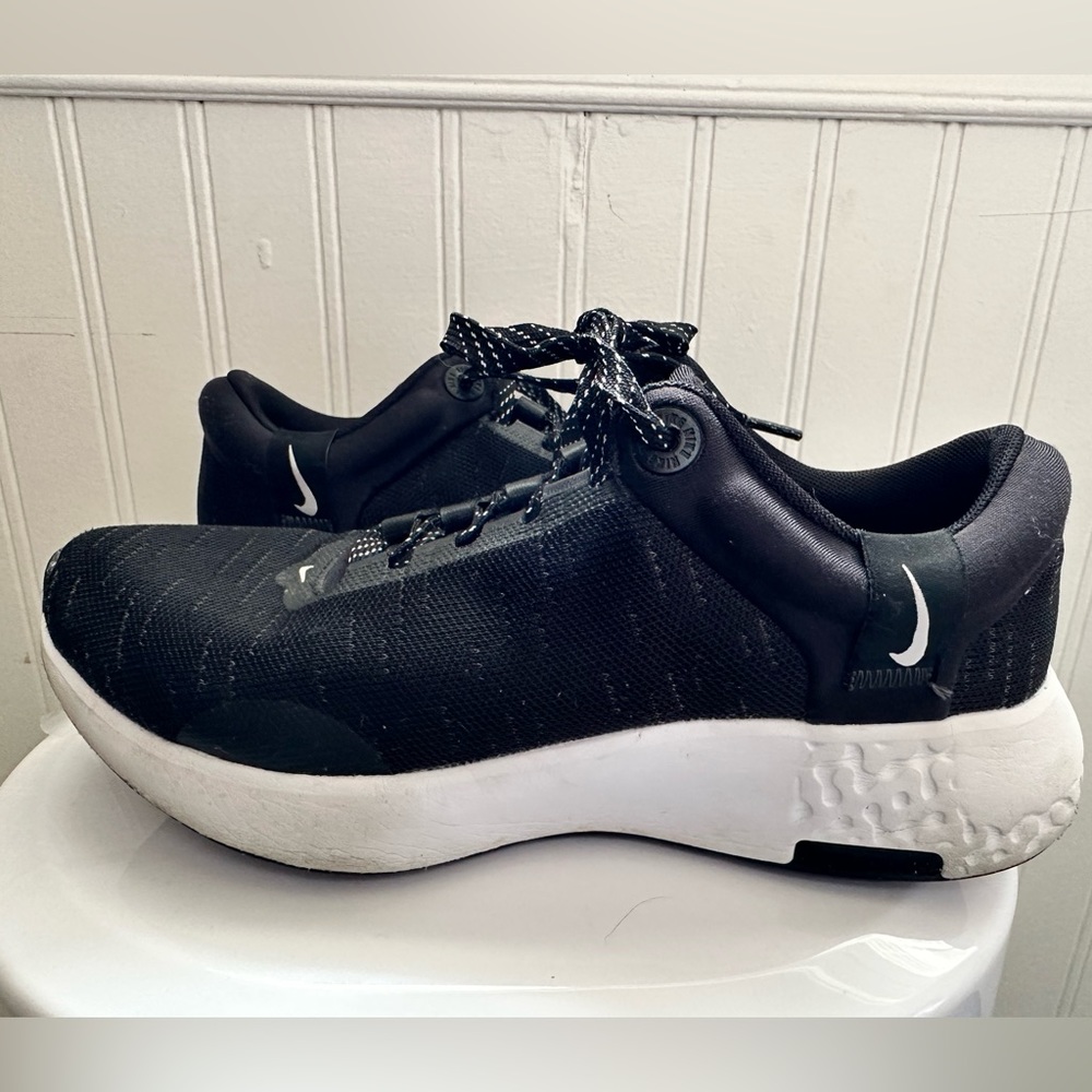 Nike running shoes black and white in a size 7.